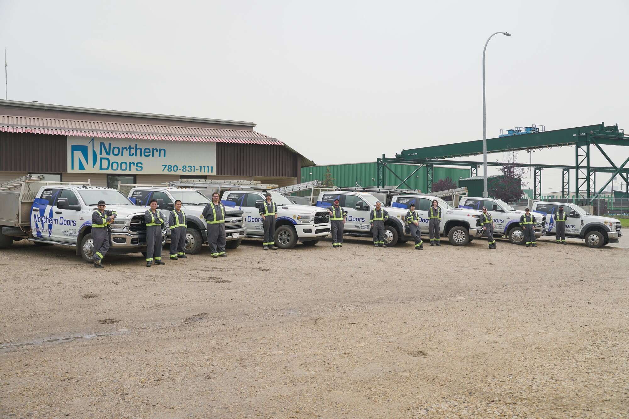 Northern Doors installers and service trucks at the Grande Prairie shop